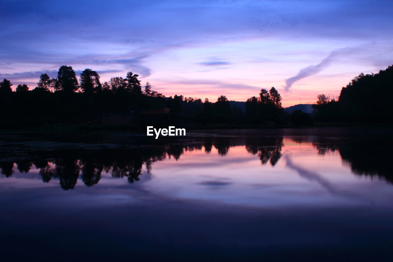 Scenic view of lake against sky during sunset