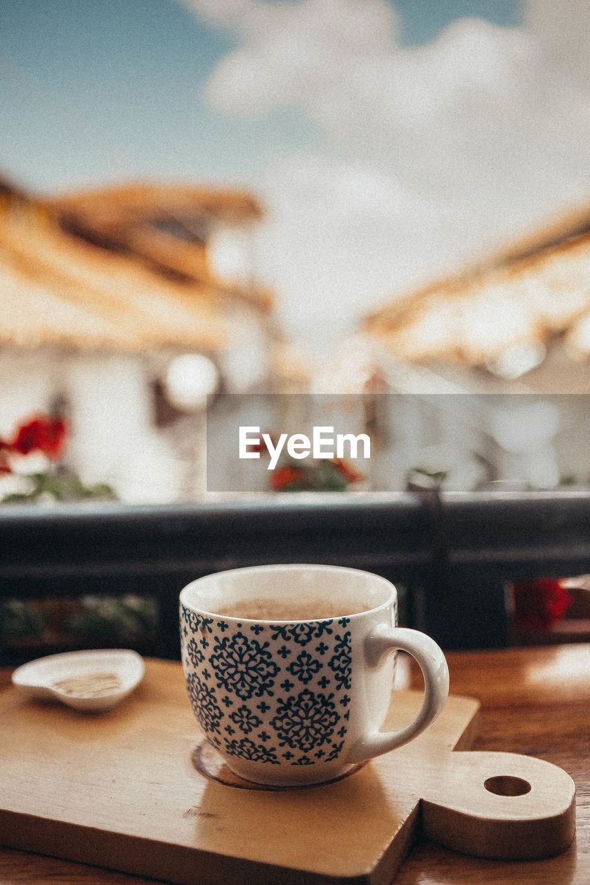 Close-up of coffee cup on table