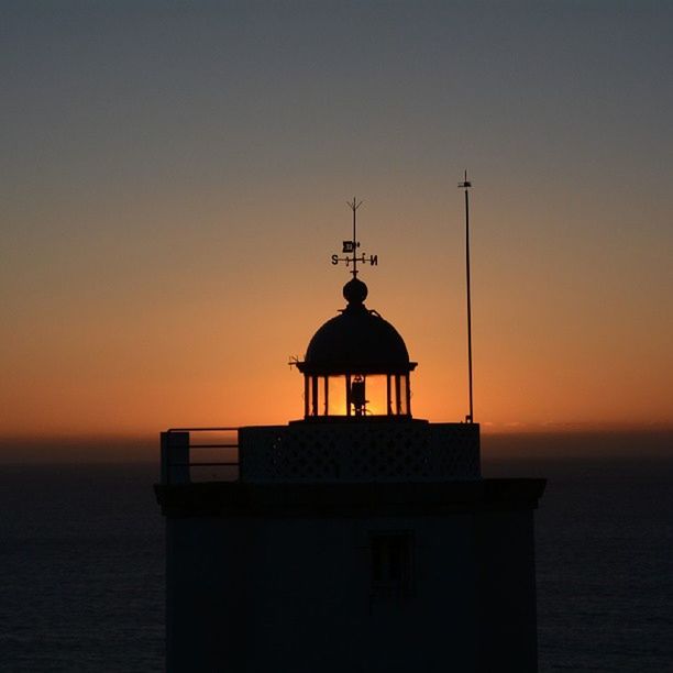 VIEW OF LIGHTHOUSE AT SUNSET