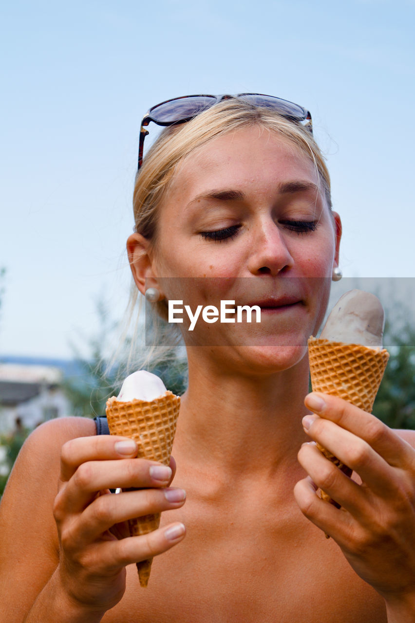 Woman looking at ice cream cone