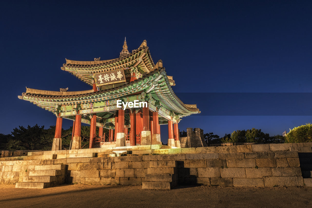 LOW ANGLE VIEW OF TEMPLE AGAINST CLEAR SKY