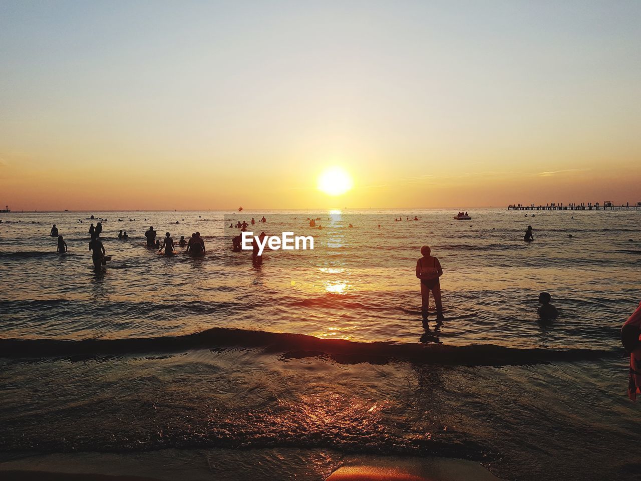 SILHOUETTE PEOPLE ON BEACH DURING SUNSET