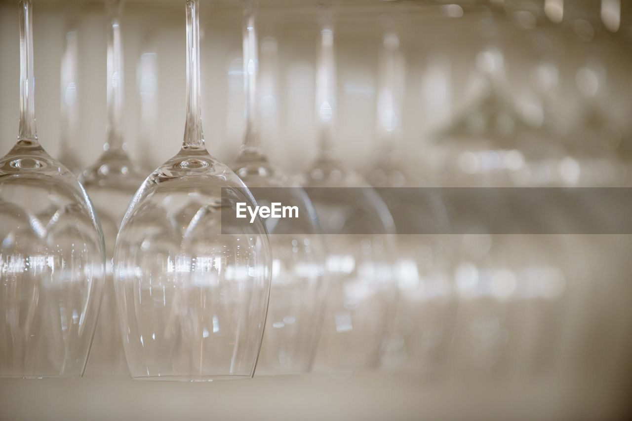 CLOSE-UP OF GLASS BOTTLES IN CONTAINER