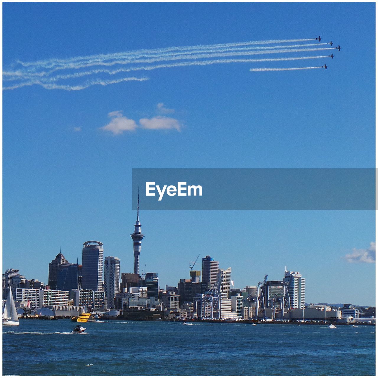 View of sea and cityscape against sky