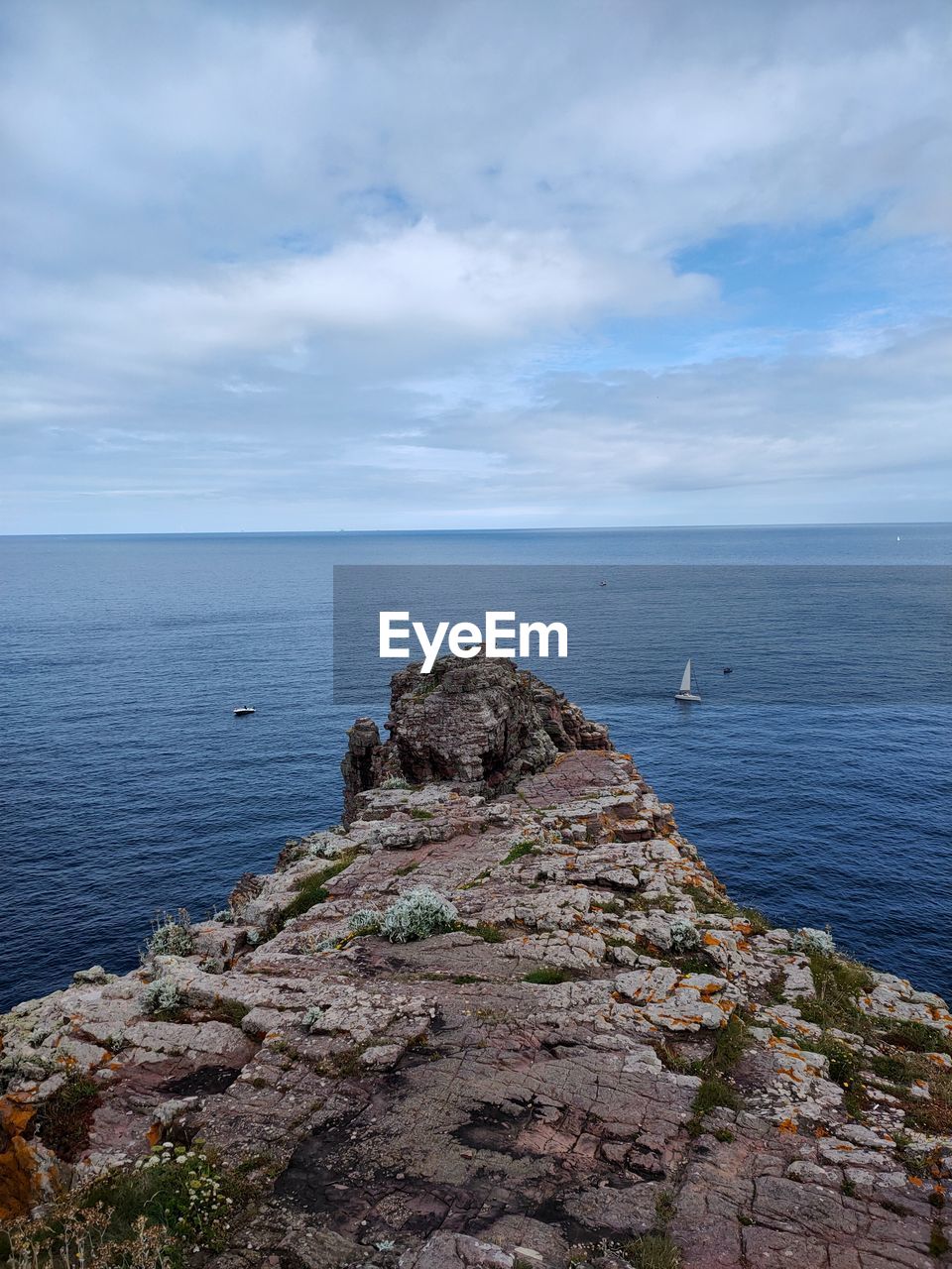 sea, water, sky, scenics - nature, rock, cloud, beauty in nature, ocean, horizon, horizon over water, coast, shore, cliff, nature, land, tranquility, beach, tranquil scene, body of water, no people, terrain, day, bay, outdoors, non-urban scene, idyllic, travel destinations, tower, coastline, travel, seascape, environment