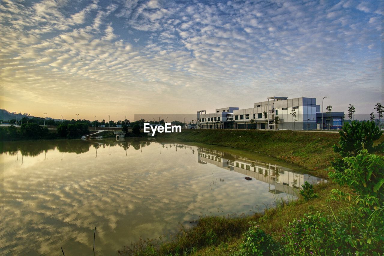 REFLECTION OF BUILDINGS IN LAKE