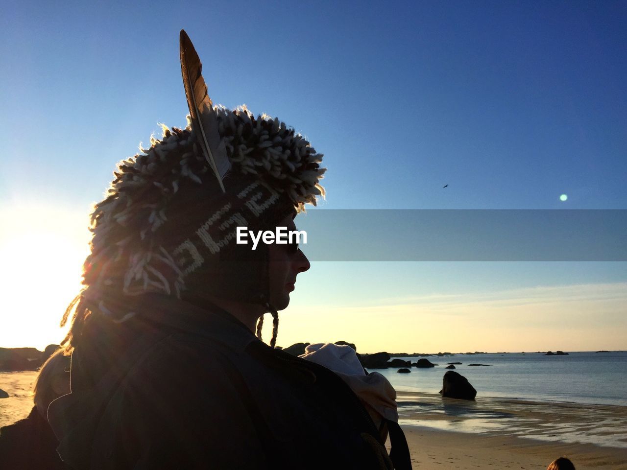 PORTRAIT OF MAN LOOKING AT SEA SHORE AGAINST SKY