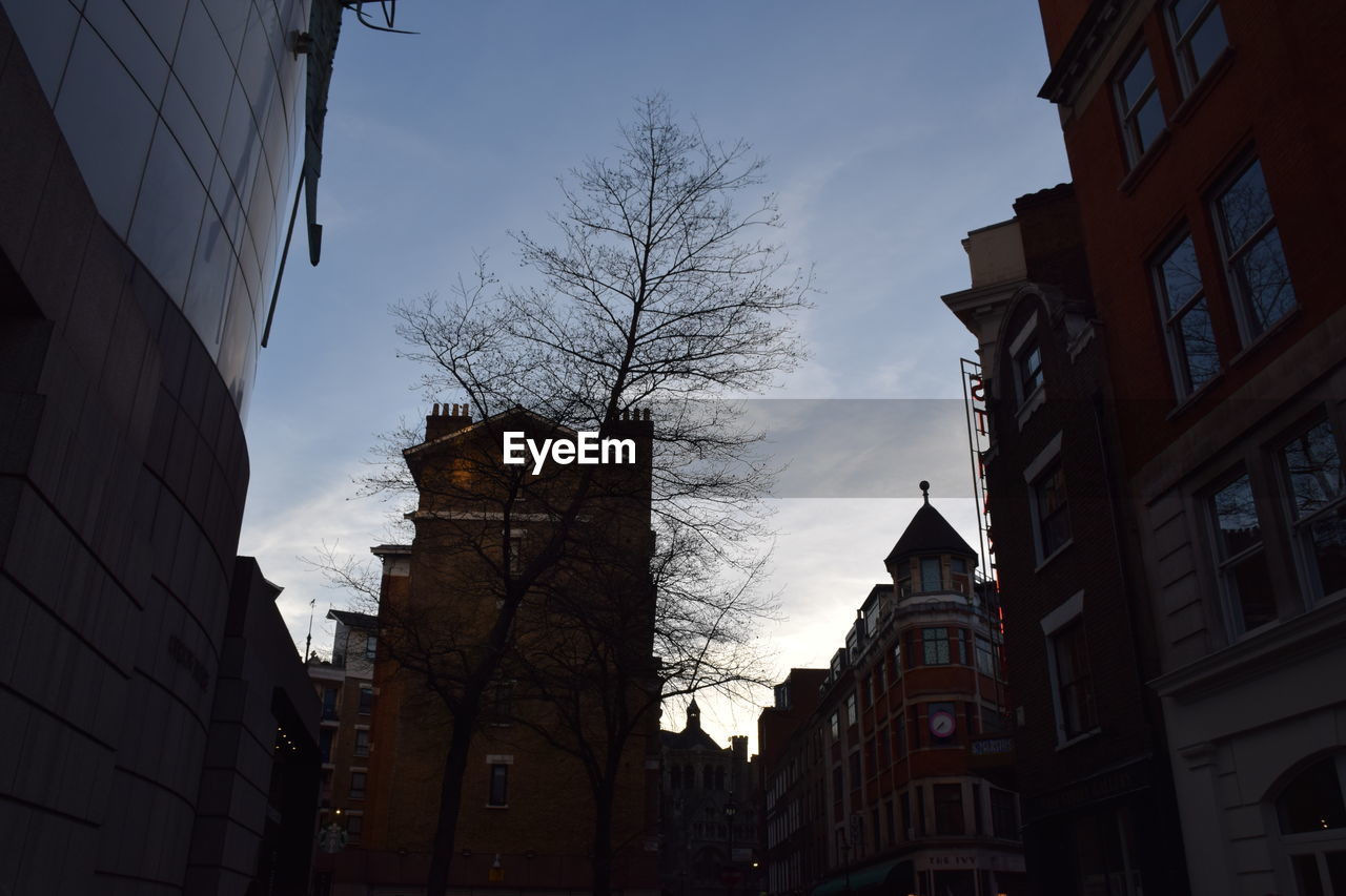 LOW ANGLE VIEW OF BUILDINGS AGAINST SKY