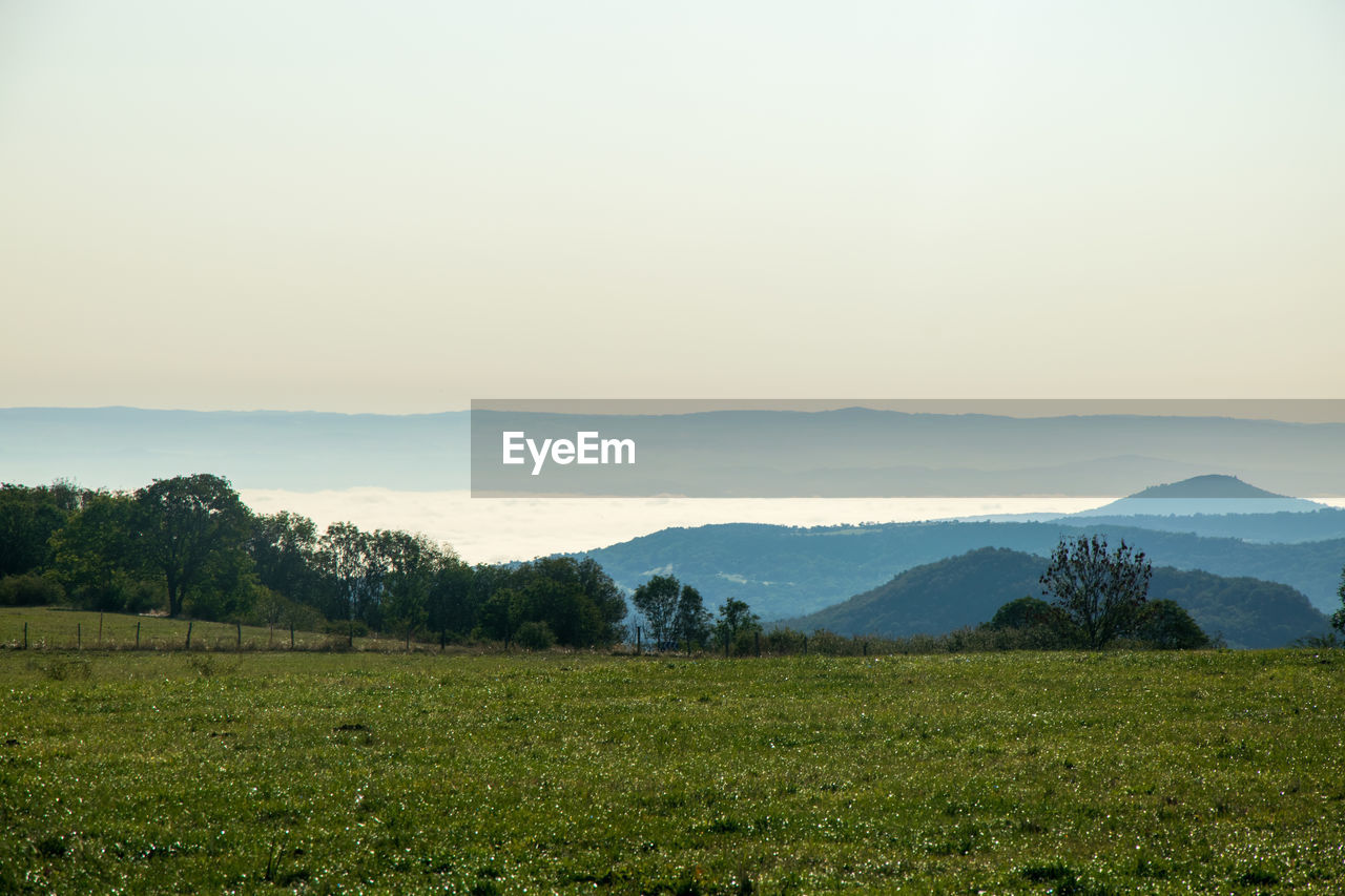 Scenic view of landscape against sky during sunset