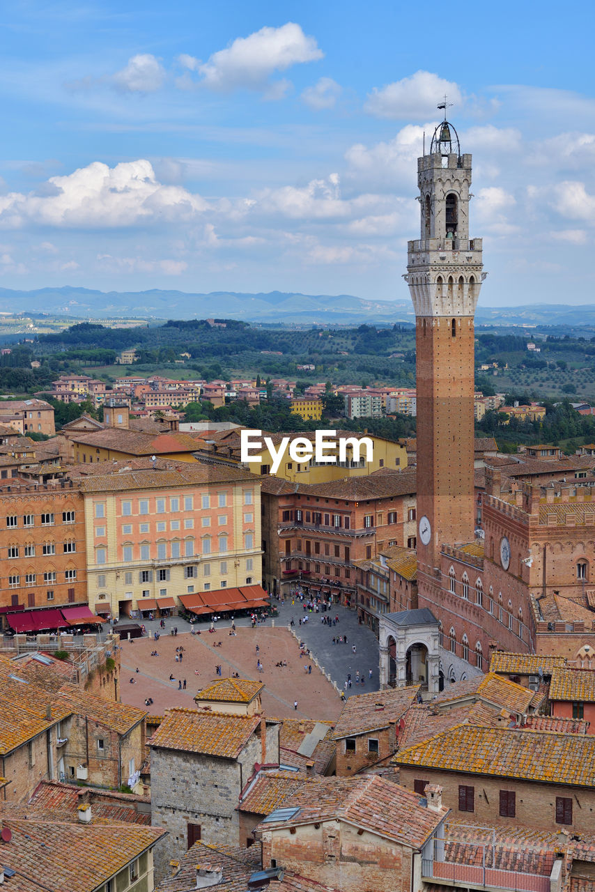 HIGH ANGLE VIEW OF CLOCK TOWER IN TOWN