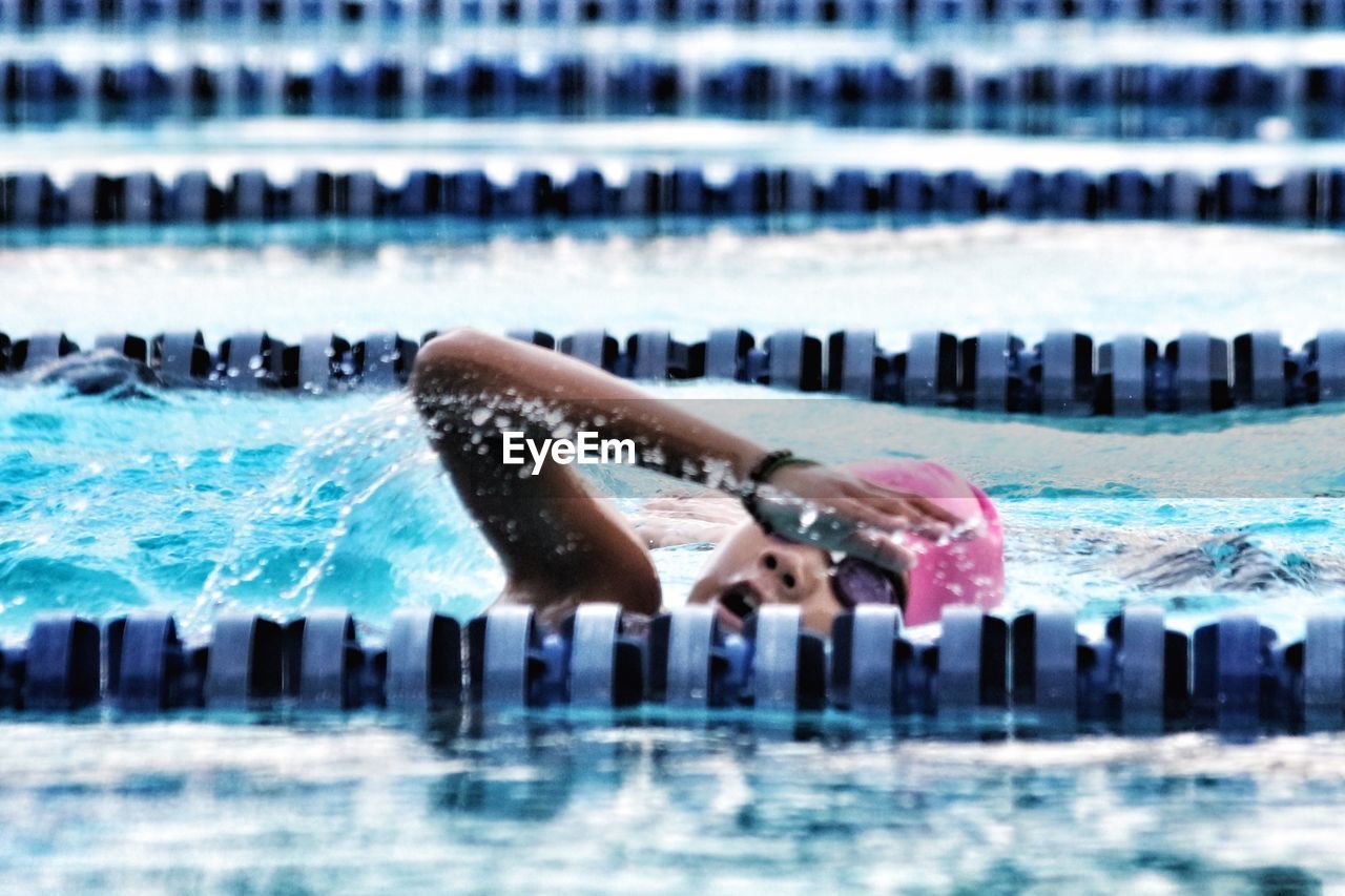 Woman swimming in pool