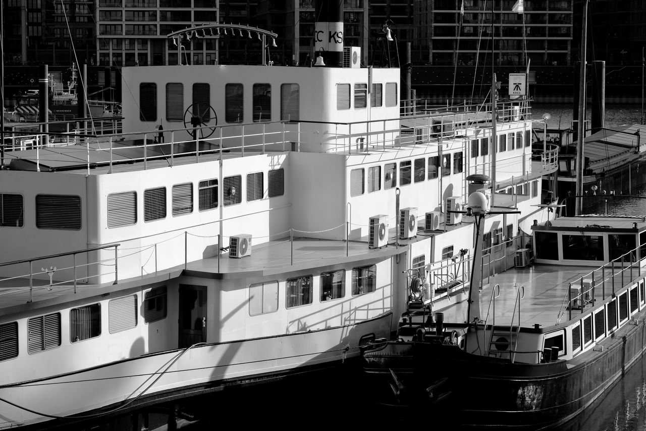 black and white, mode of transportation, transportation, architecture, monochrome, nautical vessel, monochrome photography, vehicle, built structure, building exterior, boat, ship, watercraft, passenger ship, water, moored, no people, ocean liner, city, outdoors, travel, day, nature, building, window