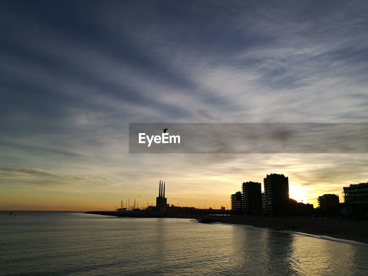 SILHOUETTE OF BUILDINGS AT SUNSET