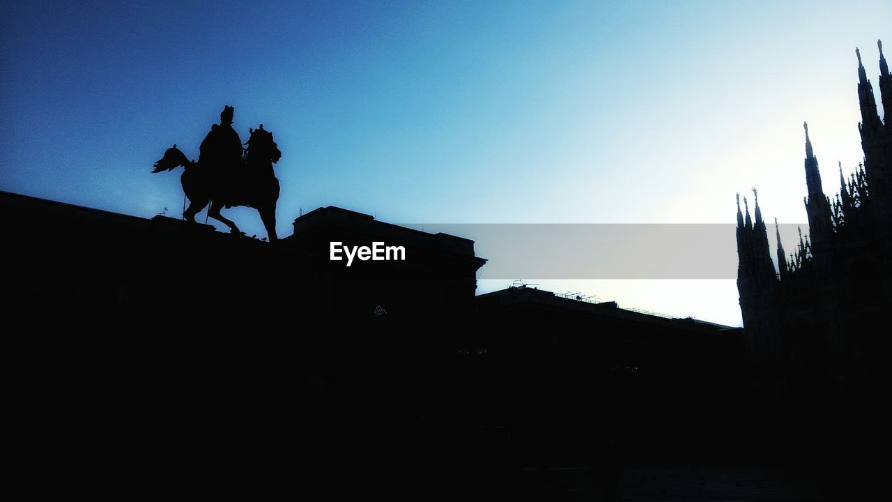 LOW ANGLE VIEW OF SILHOUETTE AGAINST SKY