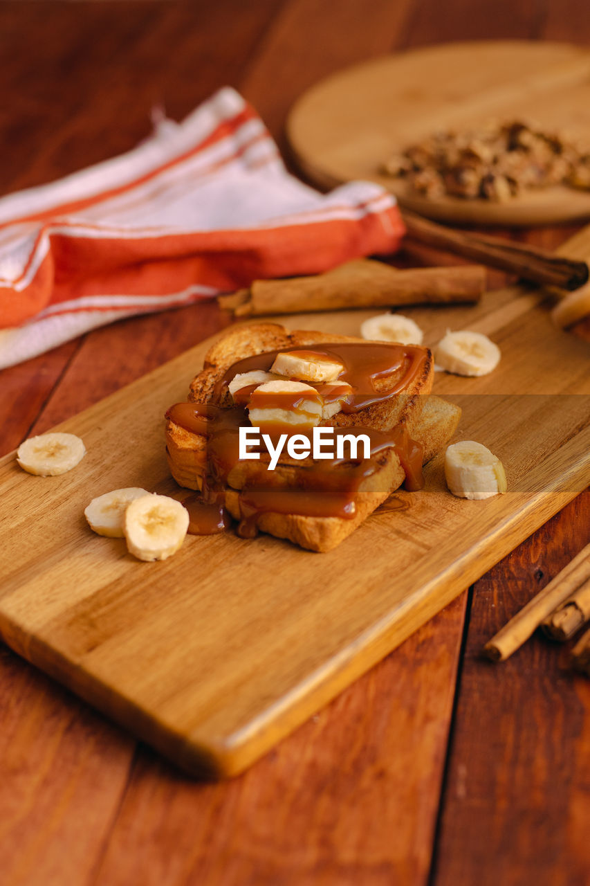 High angle view of bread on cutting board