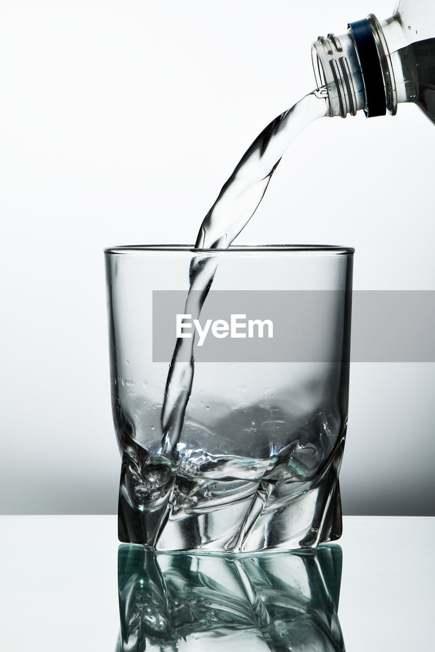 CLOSE-UP OF DRINK IN GLASS