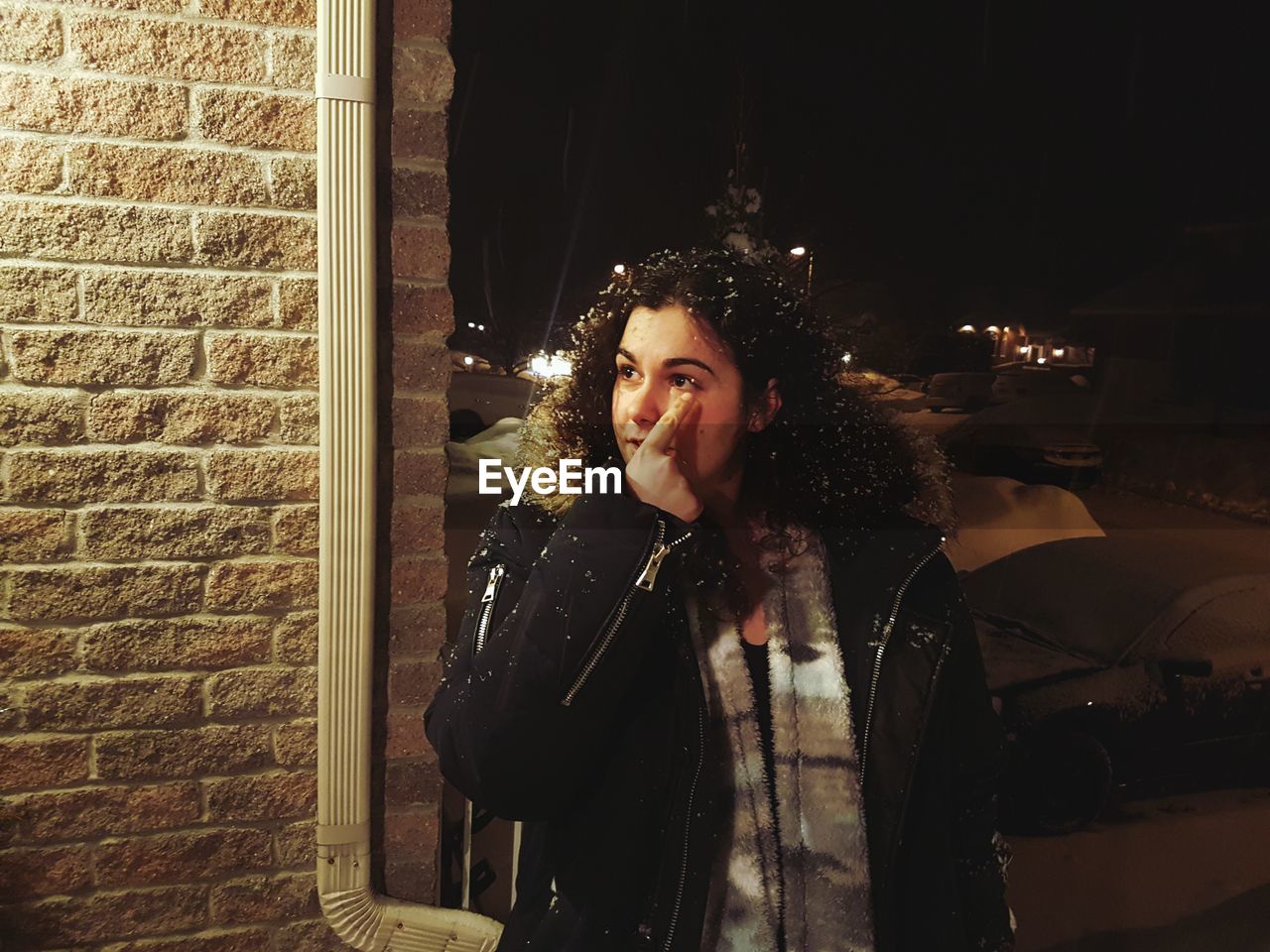 Young woman fur coat outdoors at night during winter