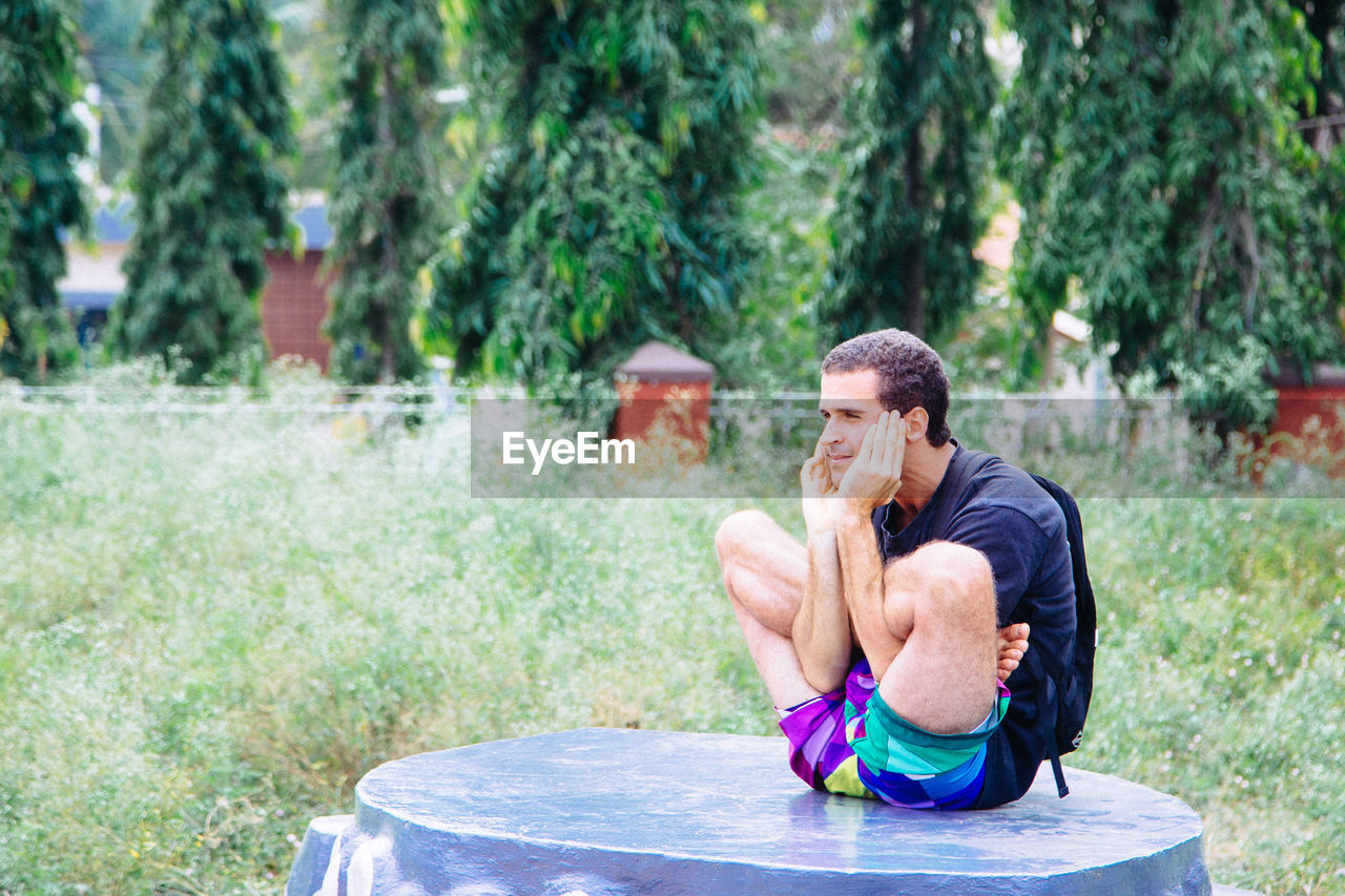 Portrait of man doing yoga