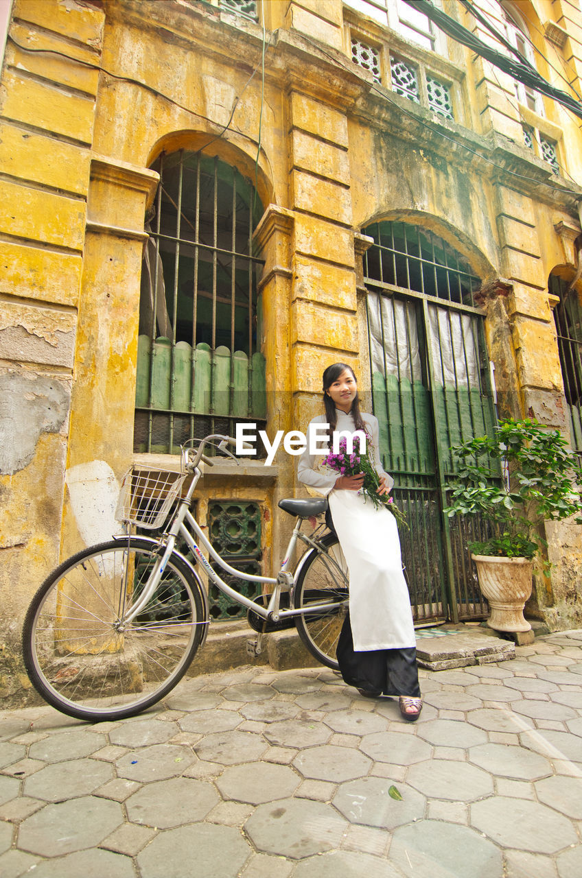 Young vietnamese girl wearing ao dai dress.