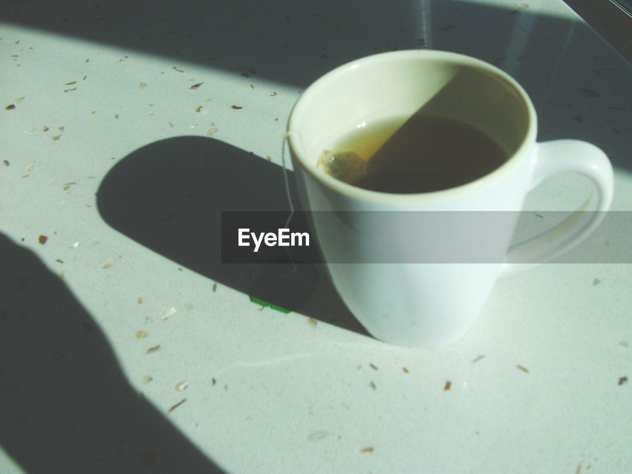 CLOSE-UP OF COFFEE CUP ON TABLE