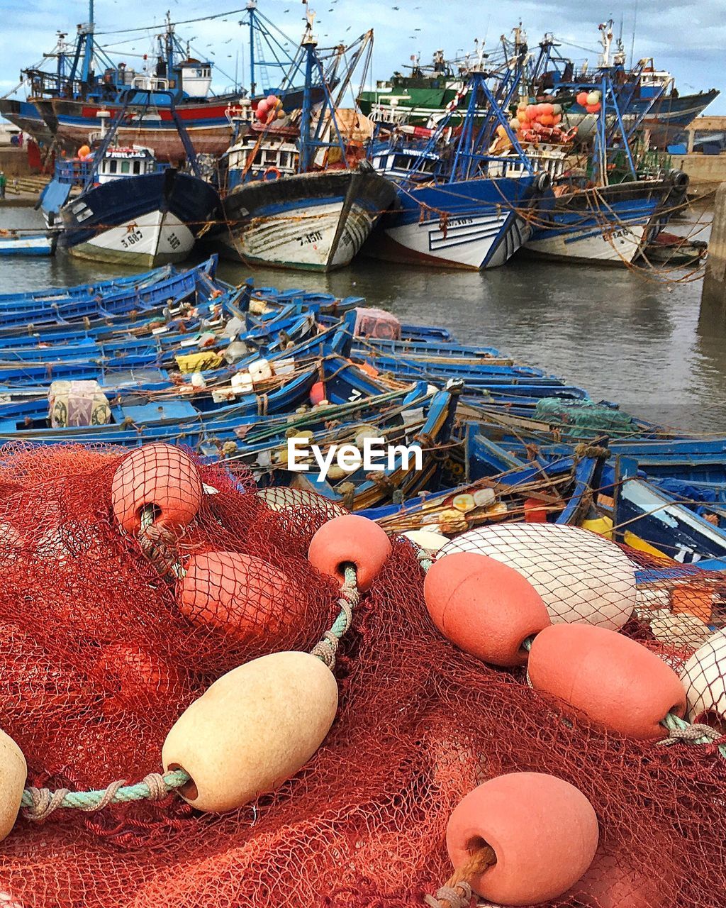 High angle view of fishing nets and buoys