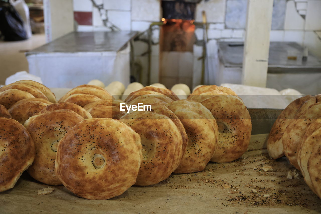 food, food and drink, bread, freshness, bakery, store, baked, loaf of bread, fast food, indoors, business, baking bread, no people, healthy eating, occupation, wellbeing, bun, business finance and industry, close-up, french food, focus on foreground, meal, retail, baker, oven