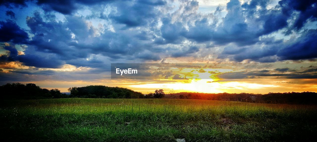 Scenic view of landscape against cloudy sky