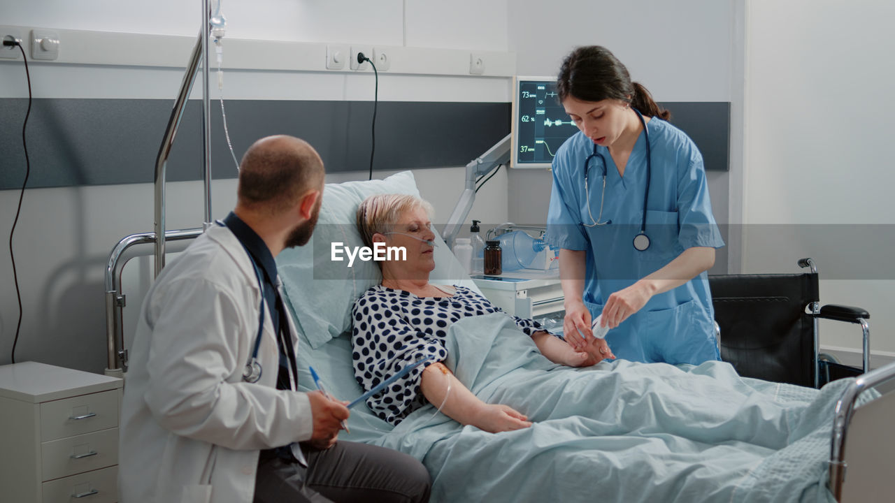 Female doctor examining patient at clinic