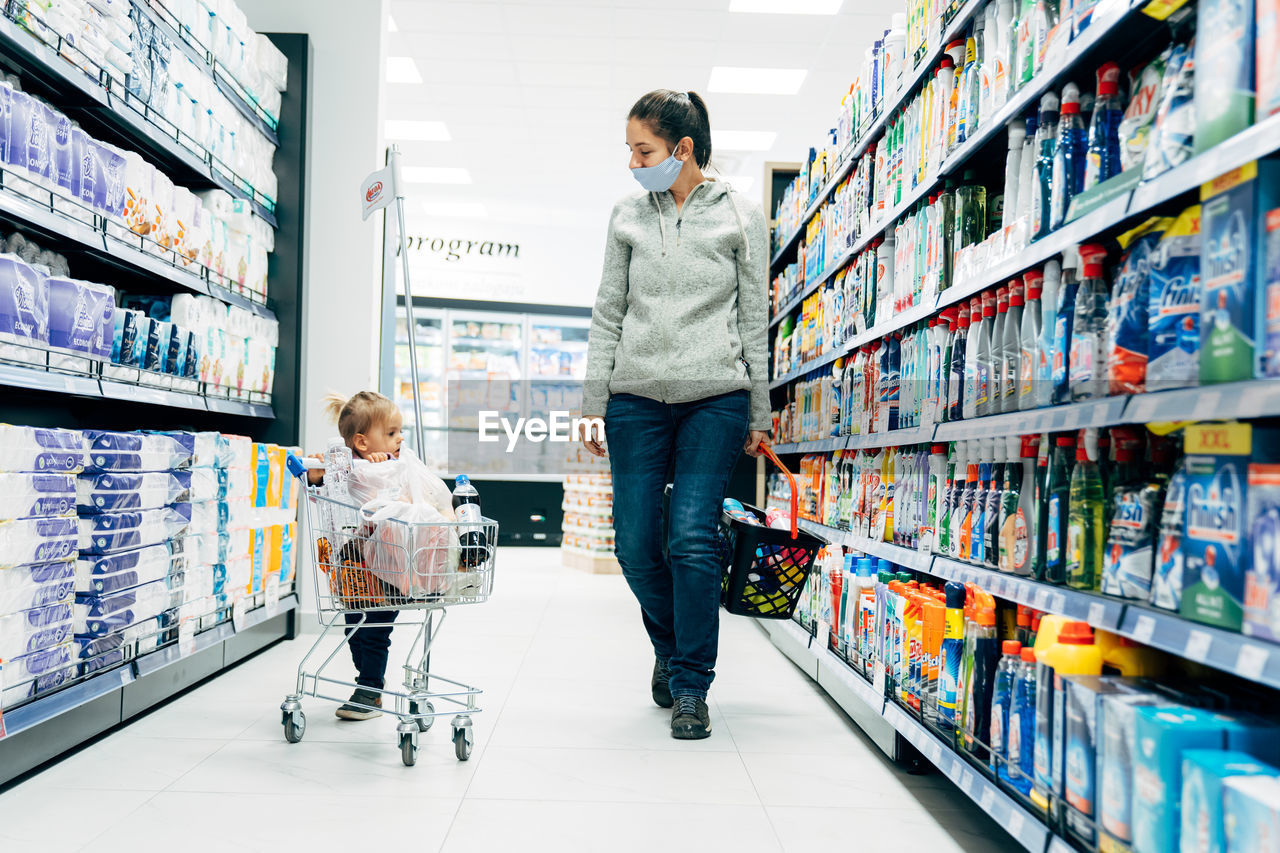 WOMAN AND SON ON DISPLAY AT SHOP