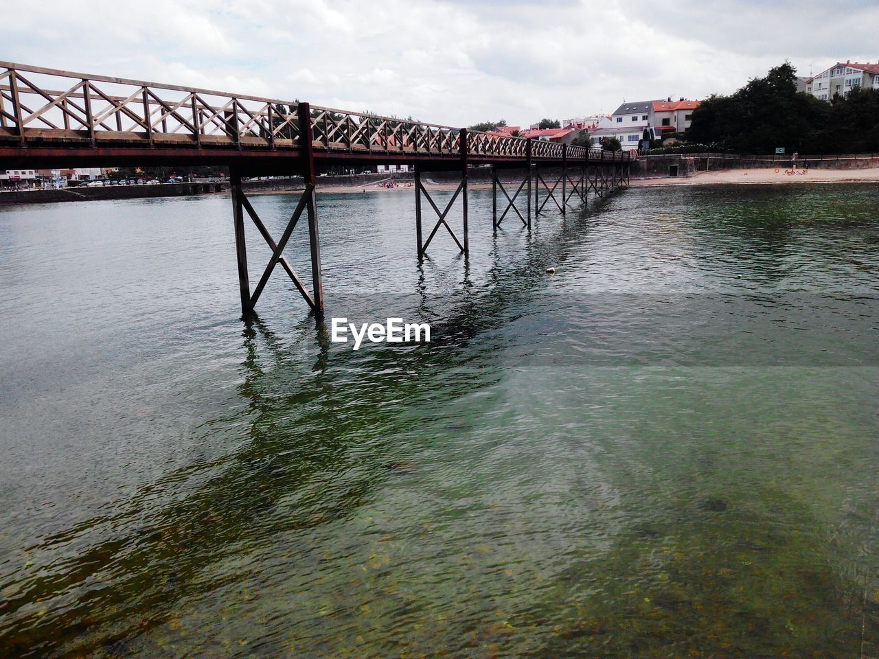 Bridge against sky at beach