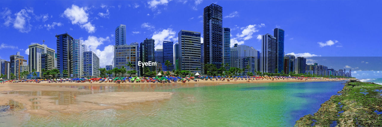 PANORAMIC VIEW OF BUILDINGS BY SEA