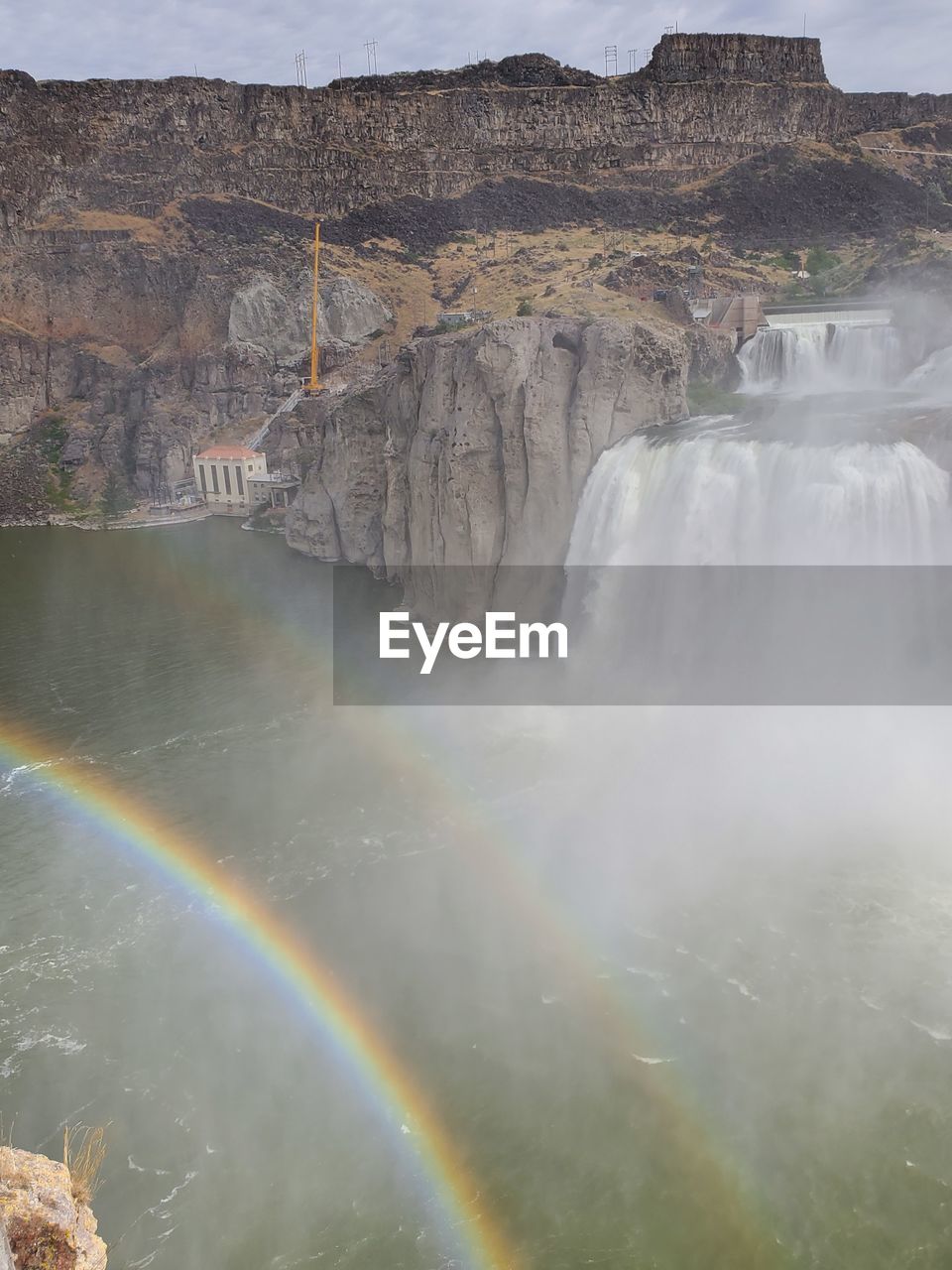 AERIAL VIEW OF RAINBOW OVER ROCKS