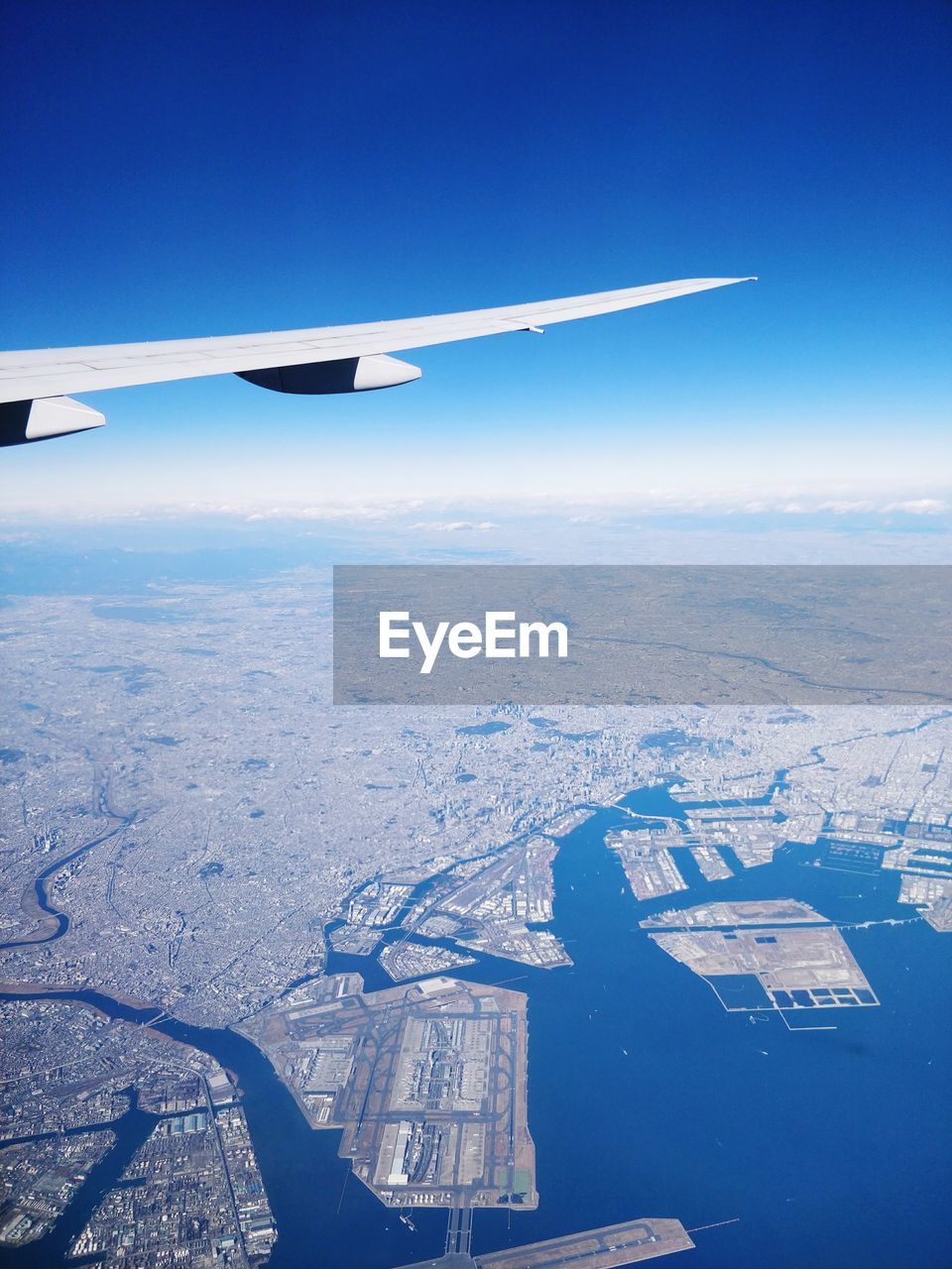 AERIAL VIEW OF AIRPLANE WING OVER LANDSCAPE