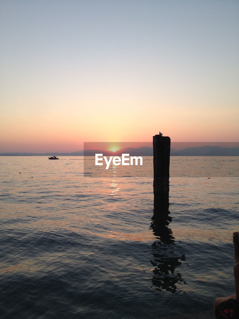 SCENIC VIEW OF SUNSET OVER SEA