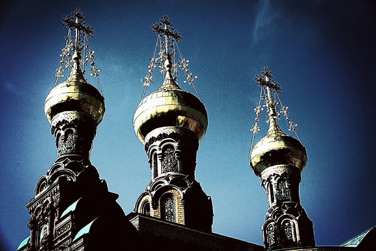 Low angle view of church against blue sky