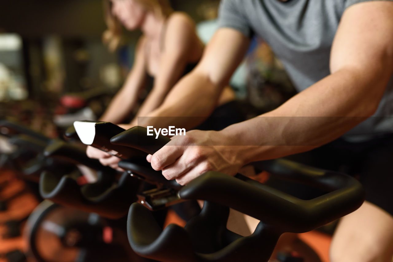 Friends exercising in gym