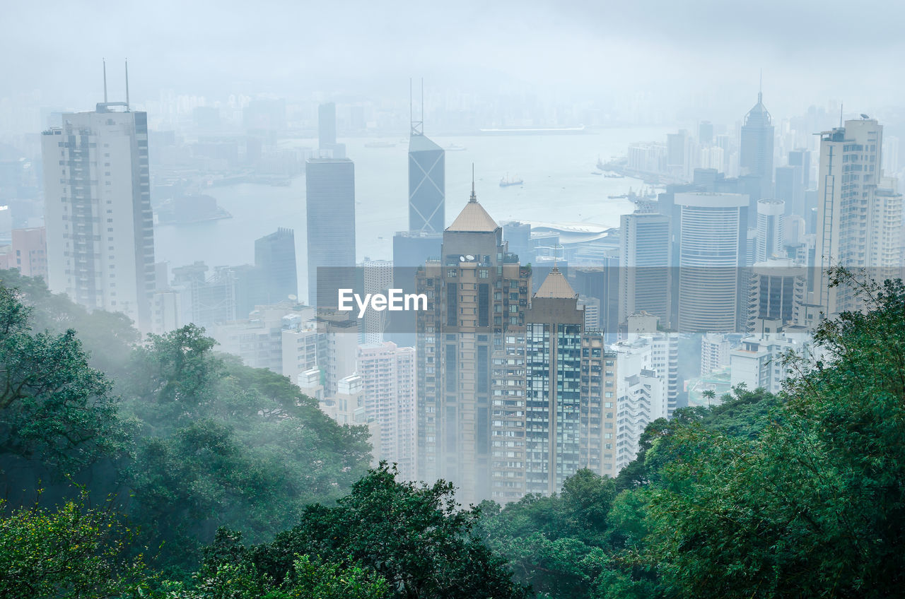 Hong kong city in fog weather viewed from victoria peak, a hill on the western half of hong kong