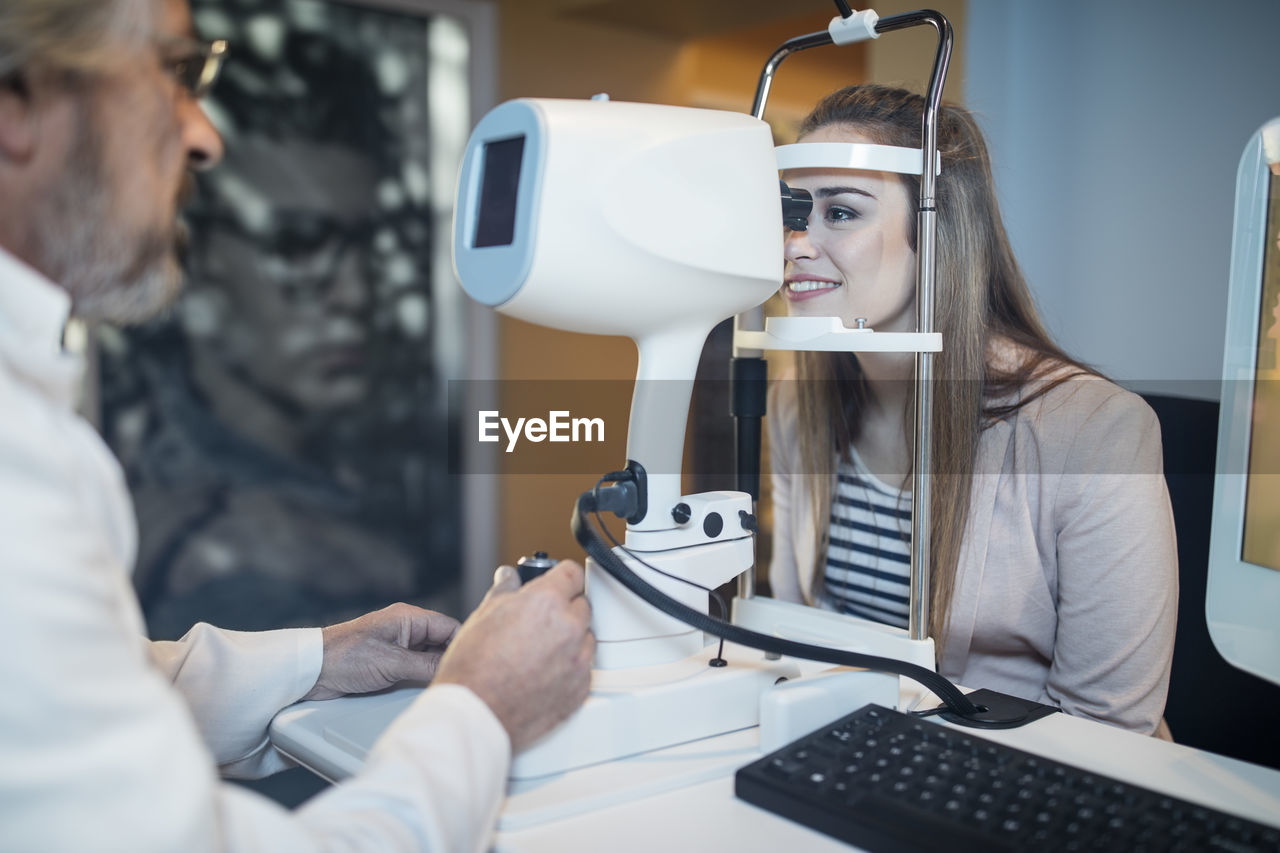 Young woman doing eye test at the optometrist's