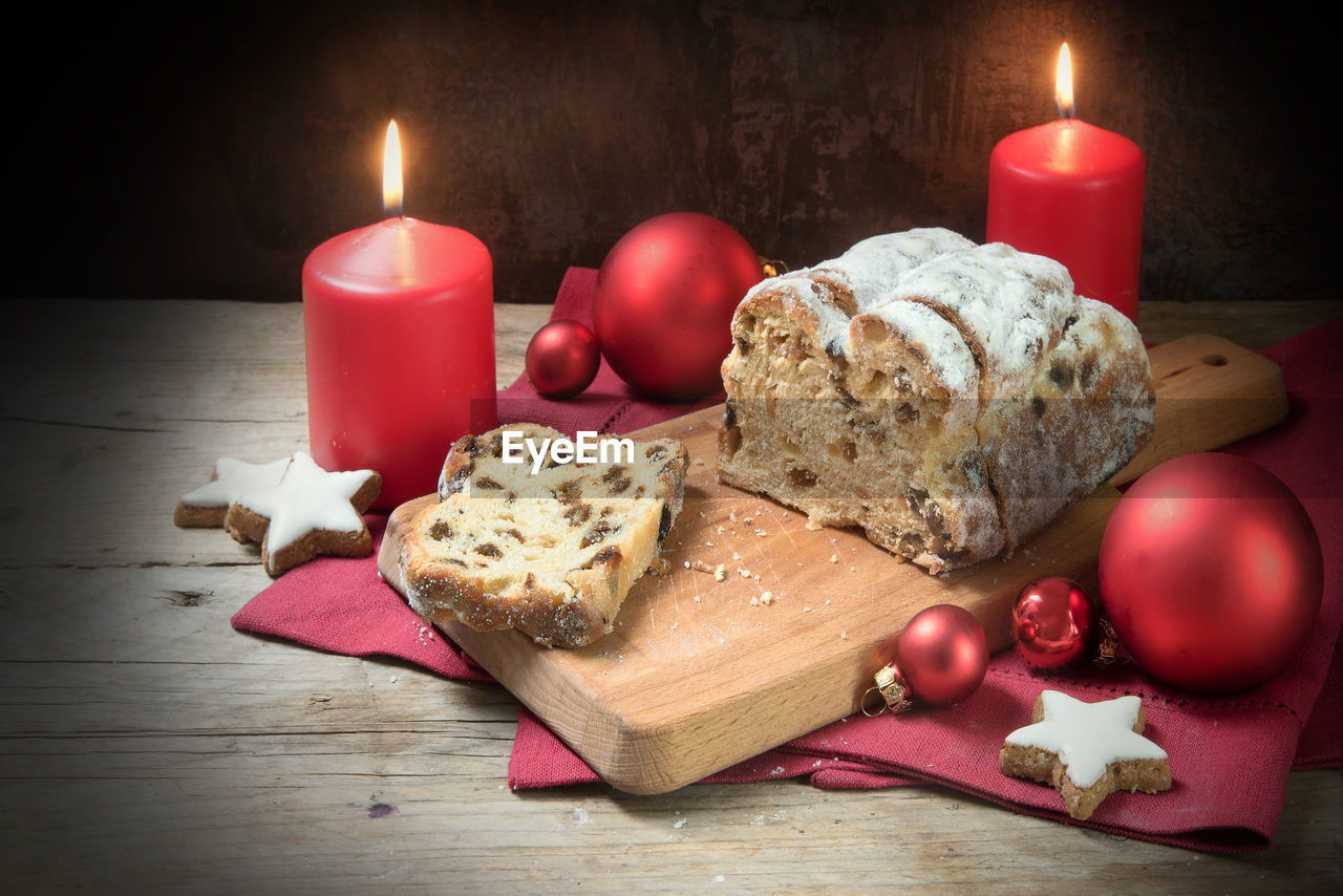 Close-up of dessert and christmas decorations on table