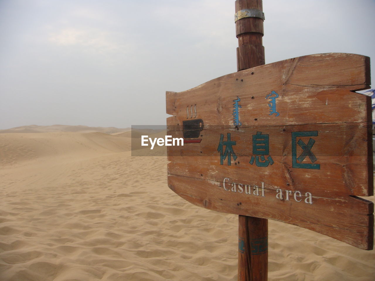 INFORMATION SIGN ON SAND DUNE