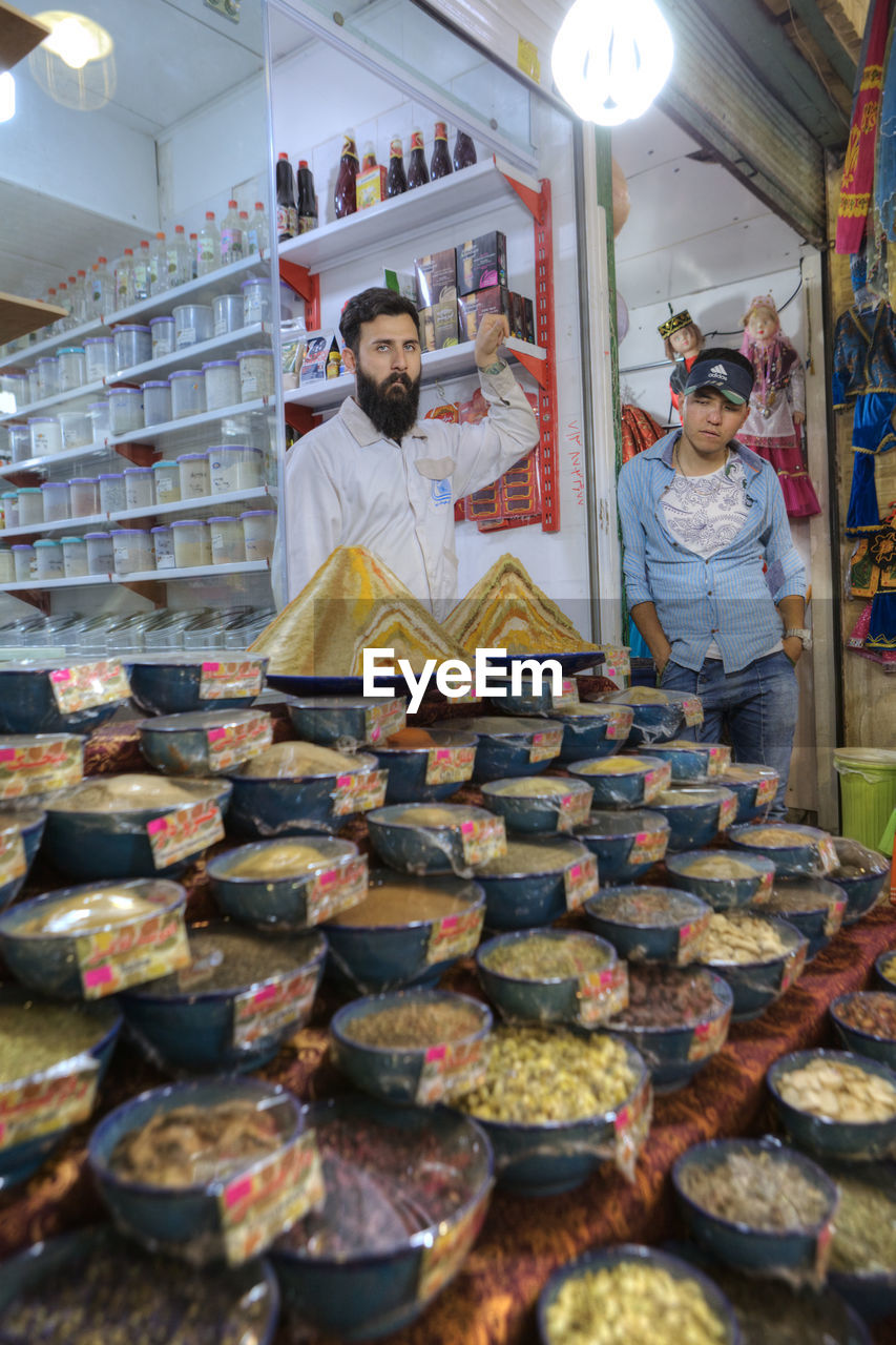 MAN WORKING AT STORE