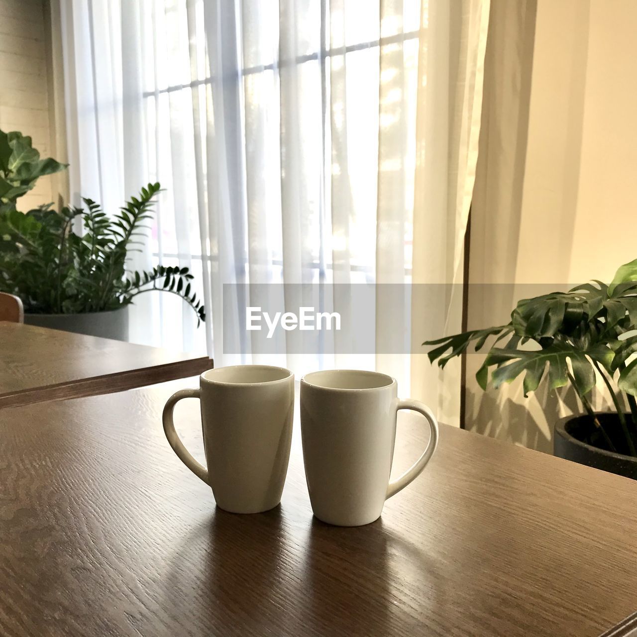 COFFEE CUP ON TABLE AT HOME