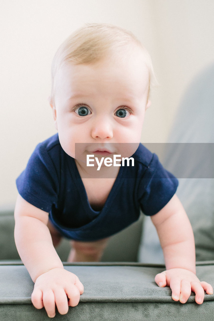 Baby staring ointo camera with wide eyes