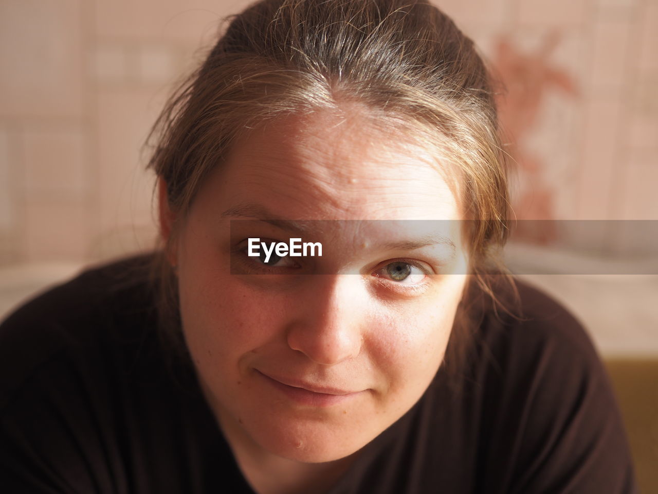 Close-up portrait of teenage girl at home