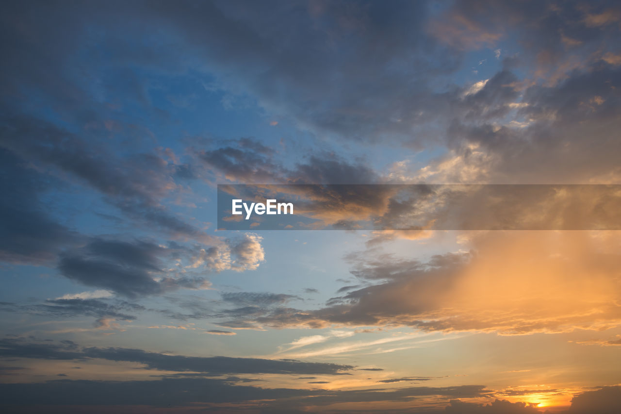 Low angle view of dramatic sky during sunset