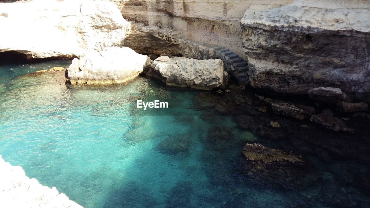 High angle view of river amidst rock formations