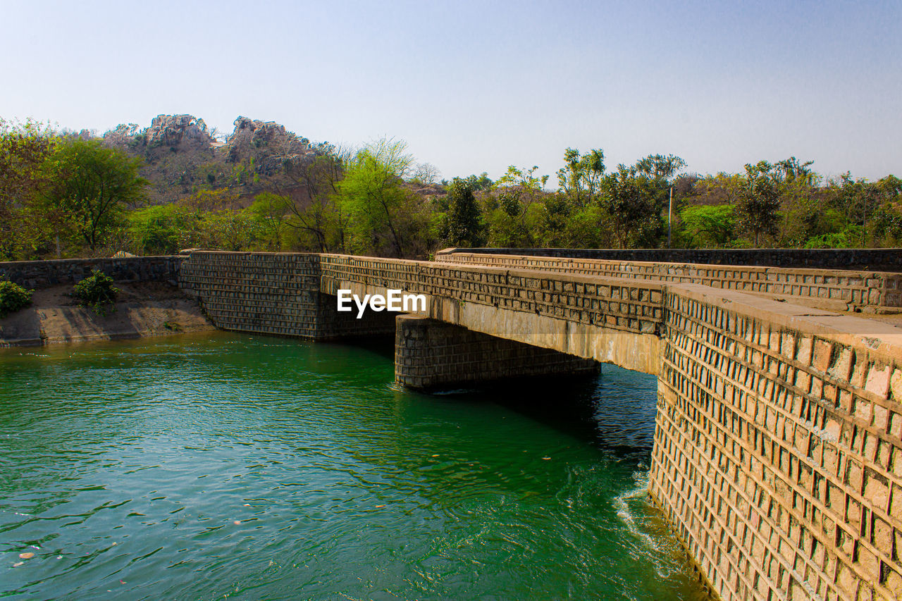 Bridge over river against sky