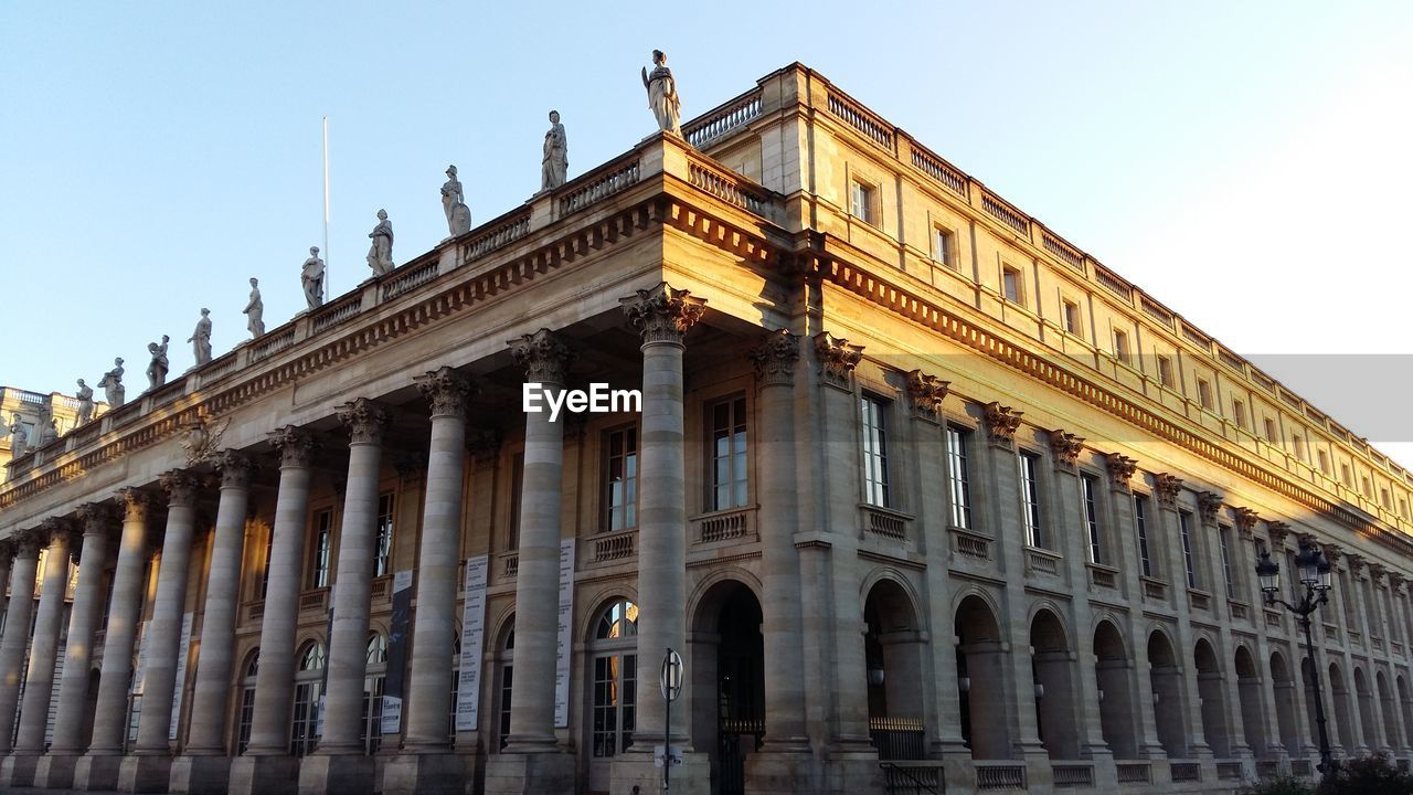 Low angle view of historic building against clear sky