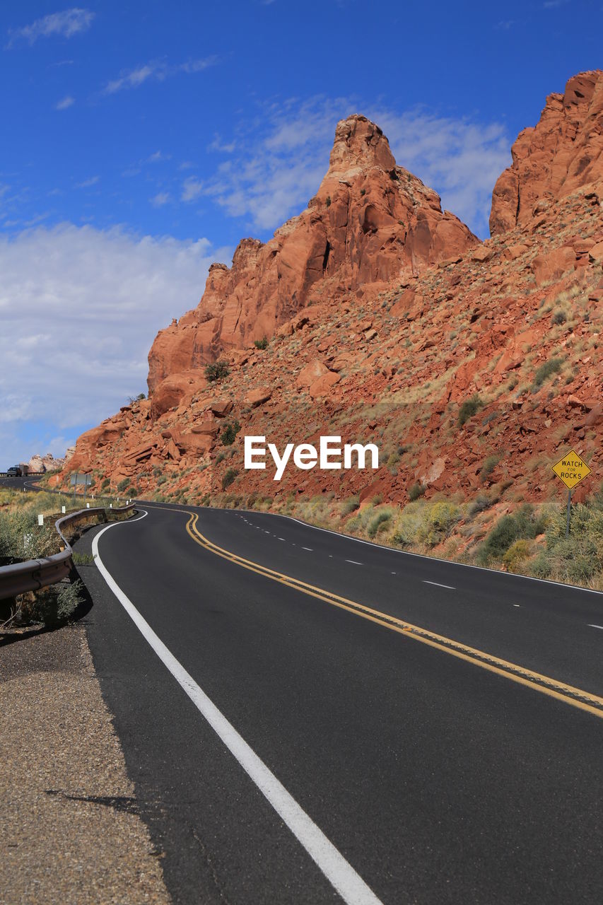 Scenic view of mountain road against sky