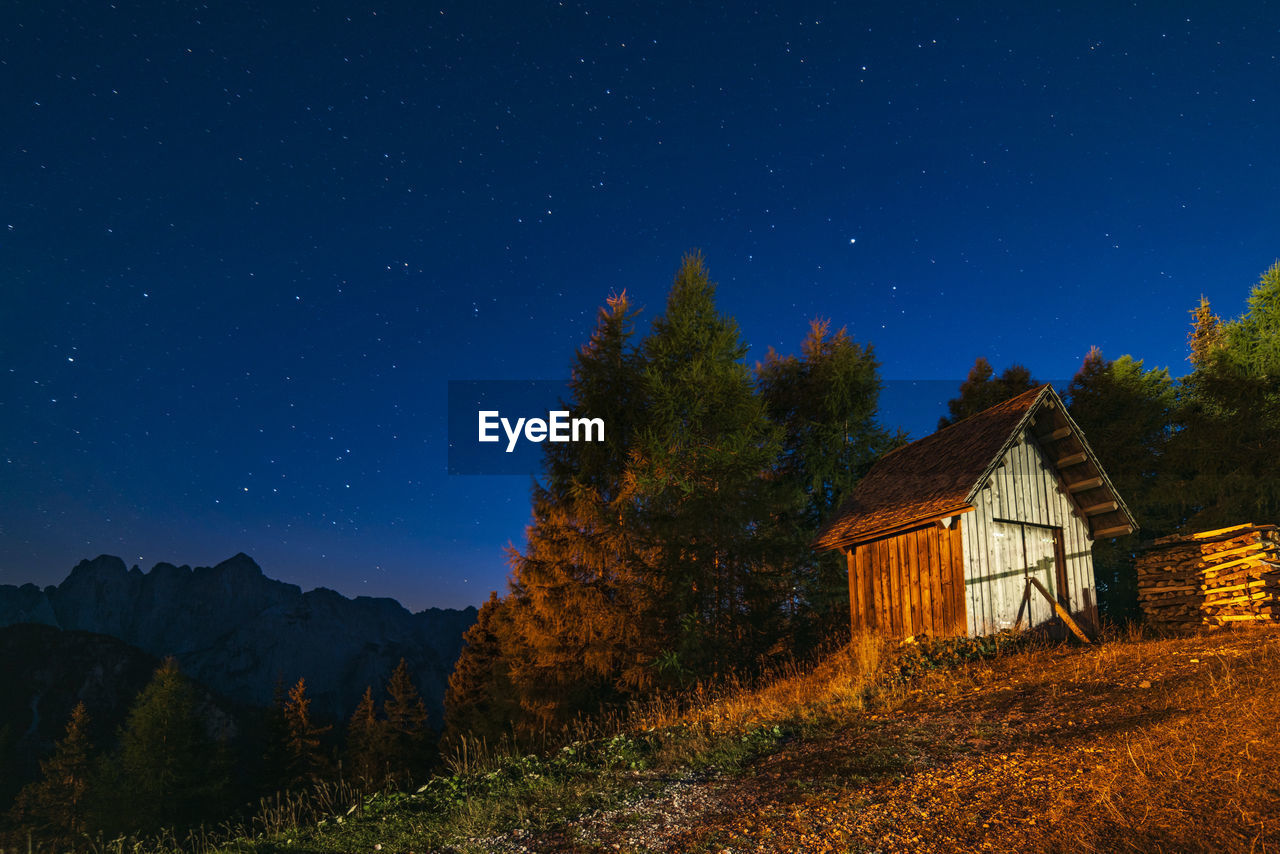 Clear and starry sky. night in the village of monte lussari. italy